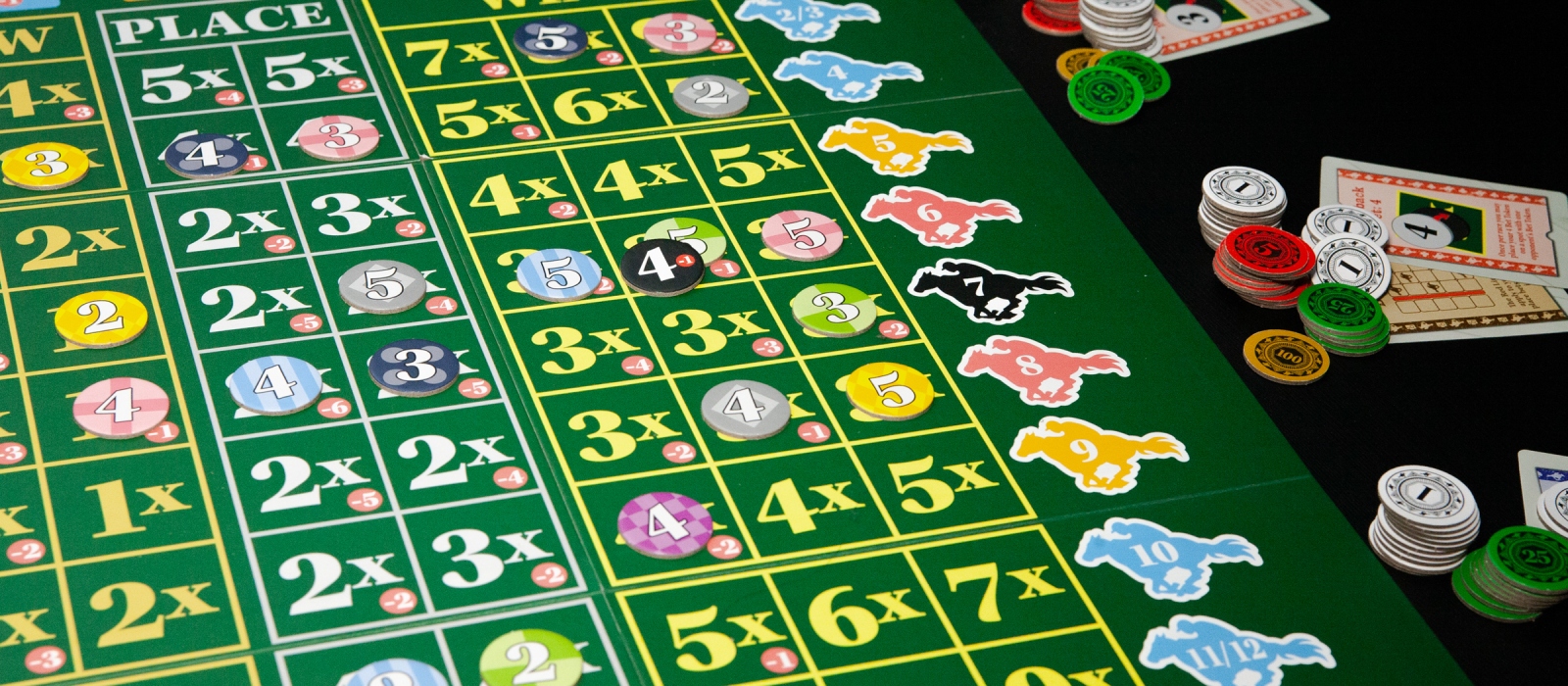 Close-up of the Ready Set Bet game board, featuring a vibrant race track and betting areas.