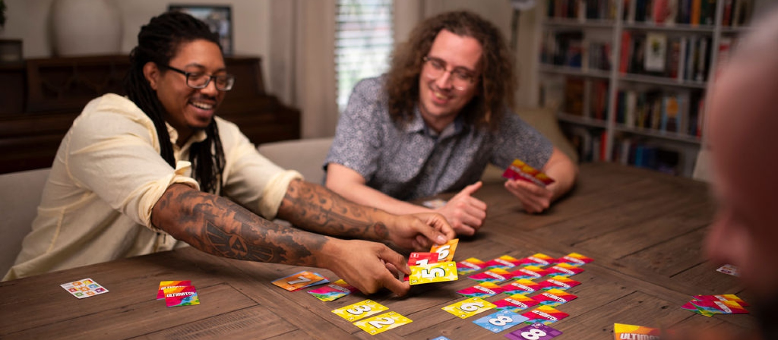 Friends playing the card game Ultimatch from Fireside Games.