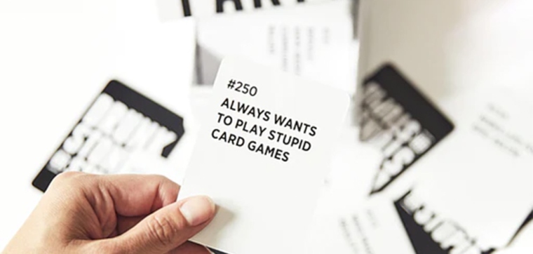 Party game Drunk Stoned or Stupid with playing cards around it